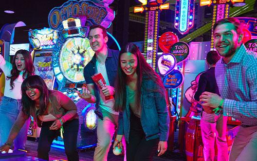 A group of friends playing games at Playdium